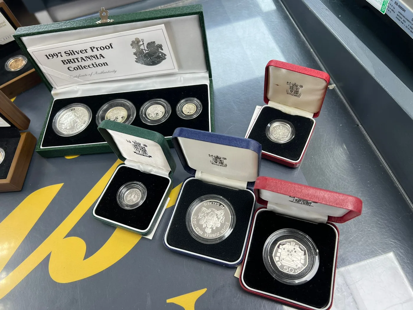 A collection of boxed silver proof and commemorative coins