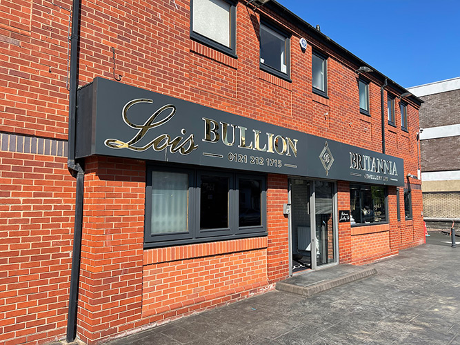 Lois Bullion shop front exterior with logo, phone number, and double door entrance.