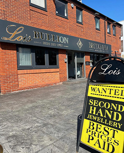 Lois Bullion shop front with logo, phone number, double door entrance, and street sign reading 'Lois wanted second hand jewellery best prices paid.'